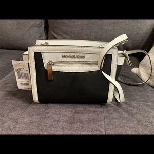 Black and white medium Michael Kors Selma crossbody bag with silver hardware